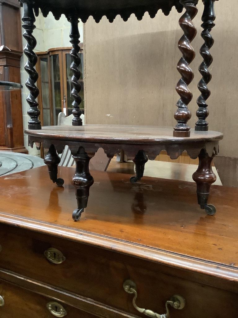 A Victorian rosewood oval three tier whatnot, width 48cm, depth 34cm, height 81cm